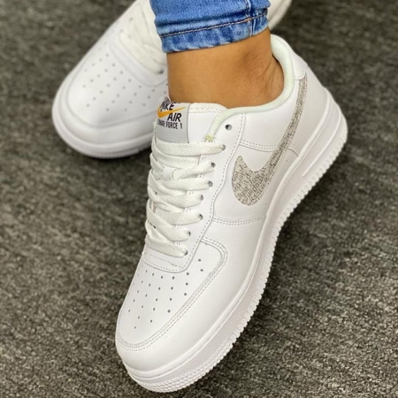 White Nike Air force Sneakers with a brown logo