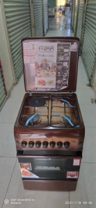 Mika 50 by 55 3 gas plates plus 1 electric Oven