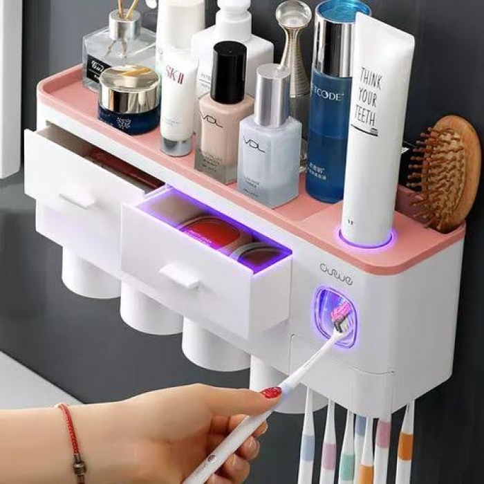 Magnetic toothpaste dispenser with 4 cups