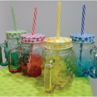 mason jar with drinking straw