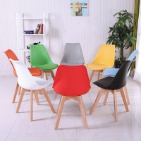 Padded Eames chair with leather cover