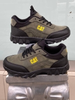 Brown waterproof CAT work boot footwear with yellow logo